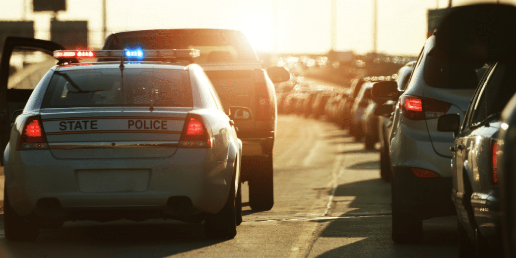 Police pulling over a driver or the DUI accident page hero image.